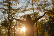 © Gajus - Woman enjoying autumn sunset