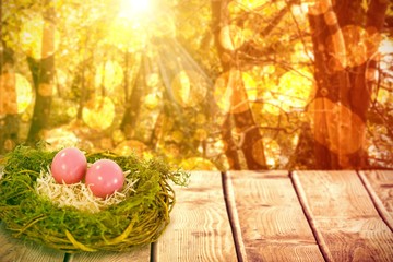 Sticker - Composite image of pink easter eggs on artificial nest