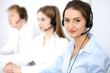 © rogerphoto - Call center. Focus on beautiful business  woman in headset.