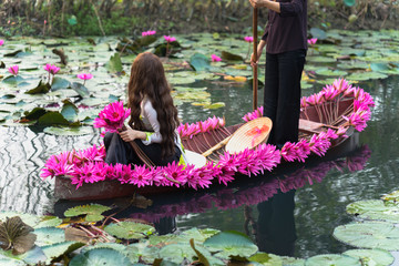 Wall Mural - Boat decorating with waterlily flowers on Yen stream, Ninh Binh, Vietnam