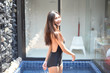 sexy asian woman in black one piece bikini