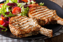Grilled Pork Steak With Bone And Fresh Salad Close-up. Horizontal