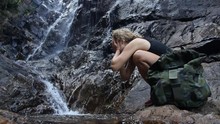 Sport Hiker Woman With Backpack At Waterfall