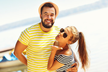 Wall Mural - Happy couple having fun outdoors in summer