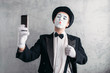 © Nomad_Soul - Pantomime actor with makeup mask makes selfie