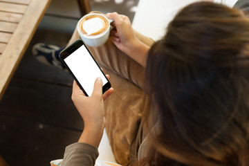 Aufkleber - Close-up woman holding phone white blank screen in coffee shop