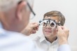 © Science RF - Male optician testing boy's eyesight