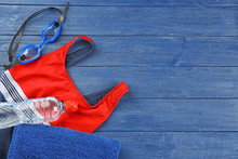 Accessories For Swimming On Wooden Background