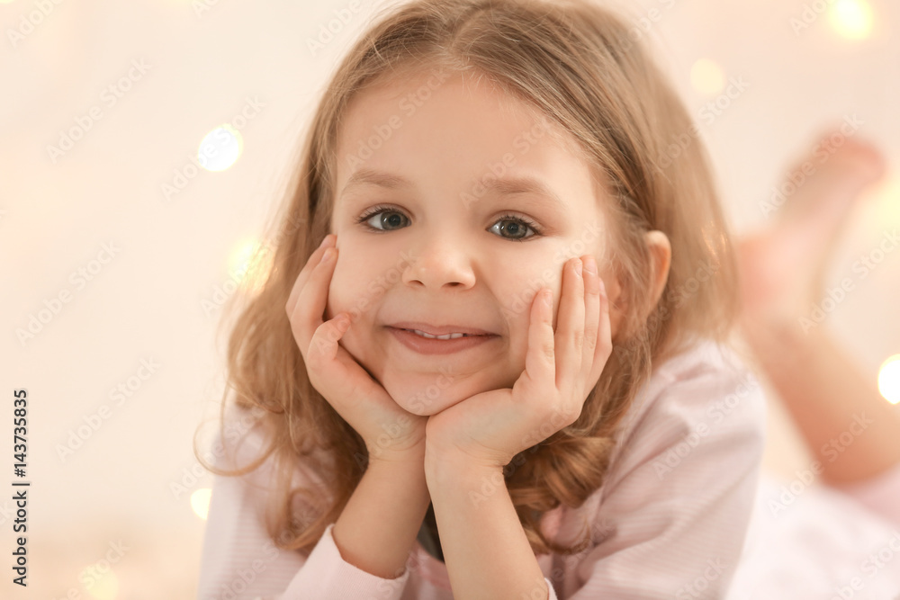 Cute little girl on blurred background