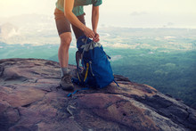 Successful Woman Hiker Packing The Backpack Hiking On Mountain Peak