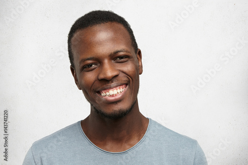 Headshot Of Handsome Young Afro American Male Looking At Camera