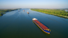 Caravan Of Barges On The River