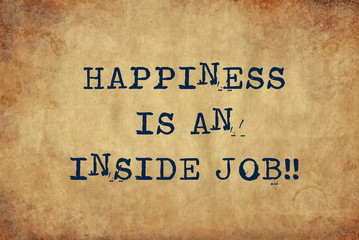 inspiring motivation quote of happiness is an inside job with typewriter text. distressed old paper 