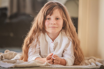 indoor portrait of young preteen girl at home