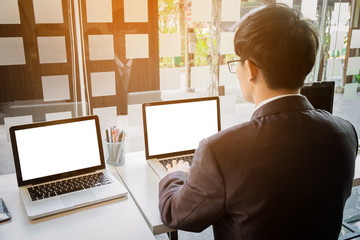 Wall Mural - business man working document and laptop in office morning light. business concept.