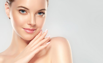 beautiful young woman with clean fresh skin look away .girl beauty face care. facial treatment . cos