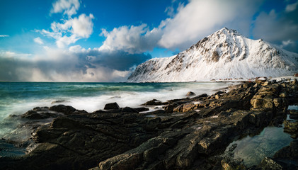 Sticker - Stones on coastline and snow mountain  in Norway