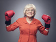 © alotofpeople - Senior lady in boxing gloves