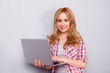 © deagreez - Pretty stylish young woman using the laptop