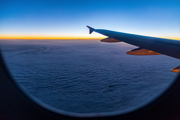 Wall Mural - aerial view from airplane window at sunset