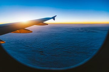 Wall Mural - aerial view from airplane window at sunset