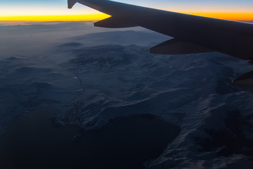 Wall Mural - aerial view from airplane window at sunset