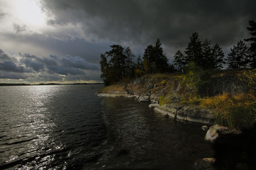 Dark clouds before thunderstorm on the lake