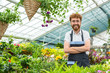 © Nestor - Male florist posing at his greenhouse