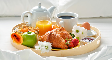 Wall Mural - Breakfast tray in bed in hotel room