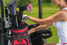 Female Golf Player Preparing For The Game