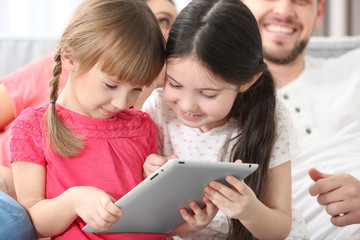 Wall Mural - Little girls with tablet at home