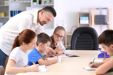 Poster - Male teacher conducting lesson in classroom