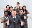 © ASDF - Smiling business people  looking at camera and showing thumbs up