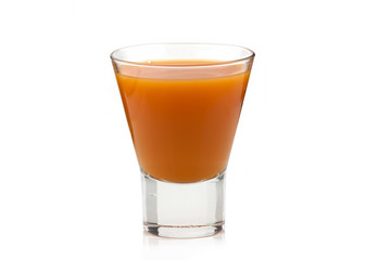 Carrot juice in a transparent cup on a white background. Isolated