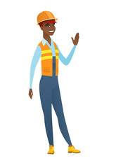 Poster - Young african-american builder waving her hand.