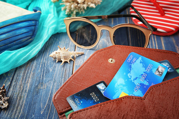 Sticker - Credit cards in wallet on wooden background