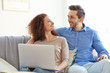 © Africa Studio - Happy young couple with laptop at home