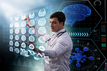 Male doctor studing x-ray image of MRI scan