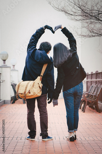 Romantic Couple In Love Gesturing A Heart With Arm Tourists On Vacation Or During Their Honeymoon In Osaka Japan Buy This Stock Photo And Explore Similar Images At Adobe Stock Adobe Romantic Couple In Love Gesturing A Heart With Arm Tourists On Vacation Or During Their Honeymoon In Osaka Japan Buy This Stock Photo And Explore Similar Images At Adobe Stock Adobe