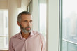 © phocal Media - Expat man looking away.
