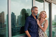 © phocal Media - Couple embracing at balcony.