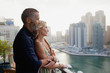 © phocal Media - Couple embracing at balcony.