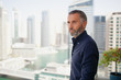© phocal Media - Expat man standing outdoors.