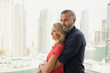 © phocal Media - Couple embracing at balcony.