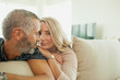 © phocal Media - Couple leaning on cushion.