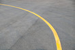 Yellow curve Traffic line on road floor texture and background
