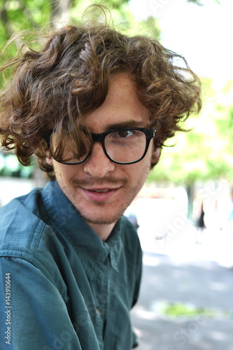 Beautiful Young Curly Haired Guy In Black Rimmed Glasses