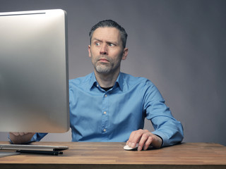 Wall Mural - Businessman working with a computer