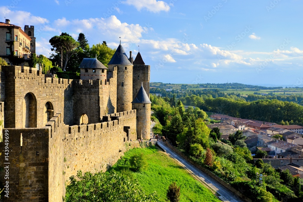 Ancient castle of Carcassonne overlooking the southern France countryside - obrazy, fototapety, plakaty 