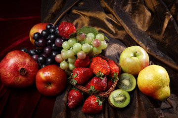 Wall Mural - Juicy bright fruit, sprinkled with water, still life of seasonal fruits and berries, top view